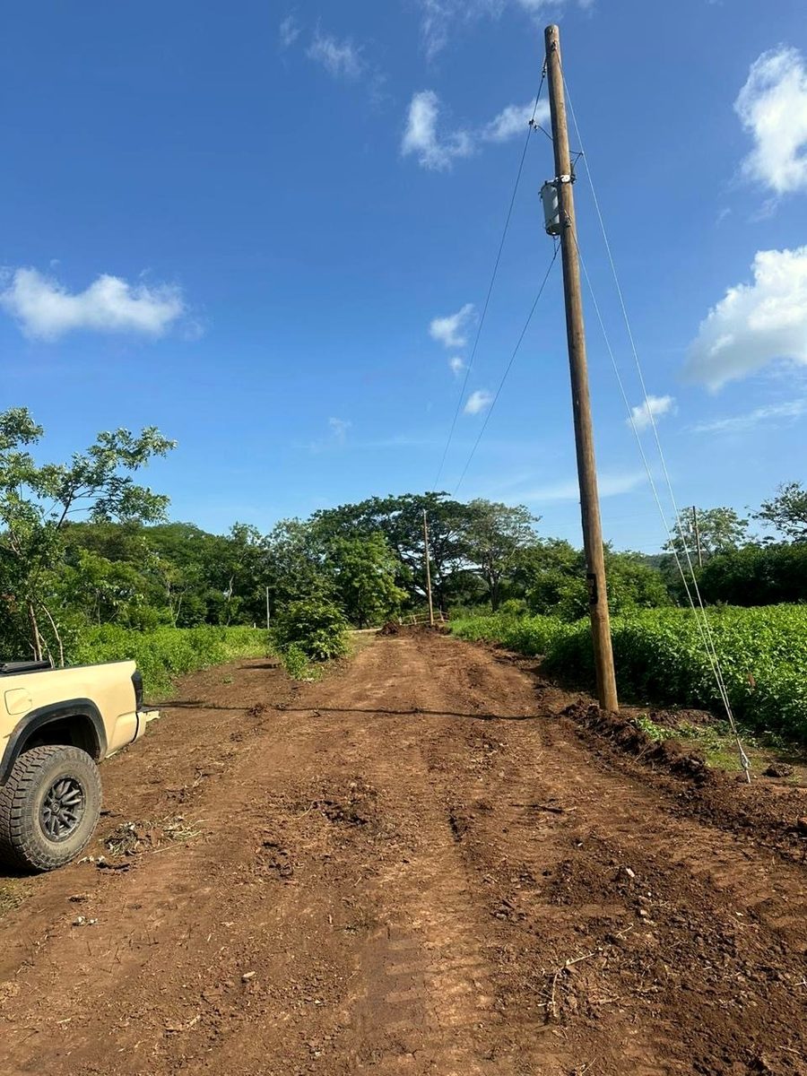 Graded access road with a new power pole